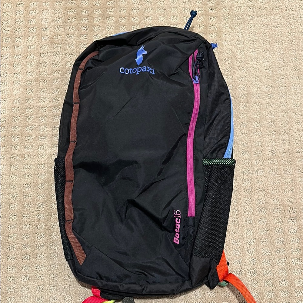 Cotopaxi Black and Pink Backpack for Adventurers